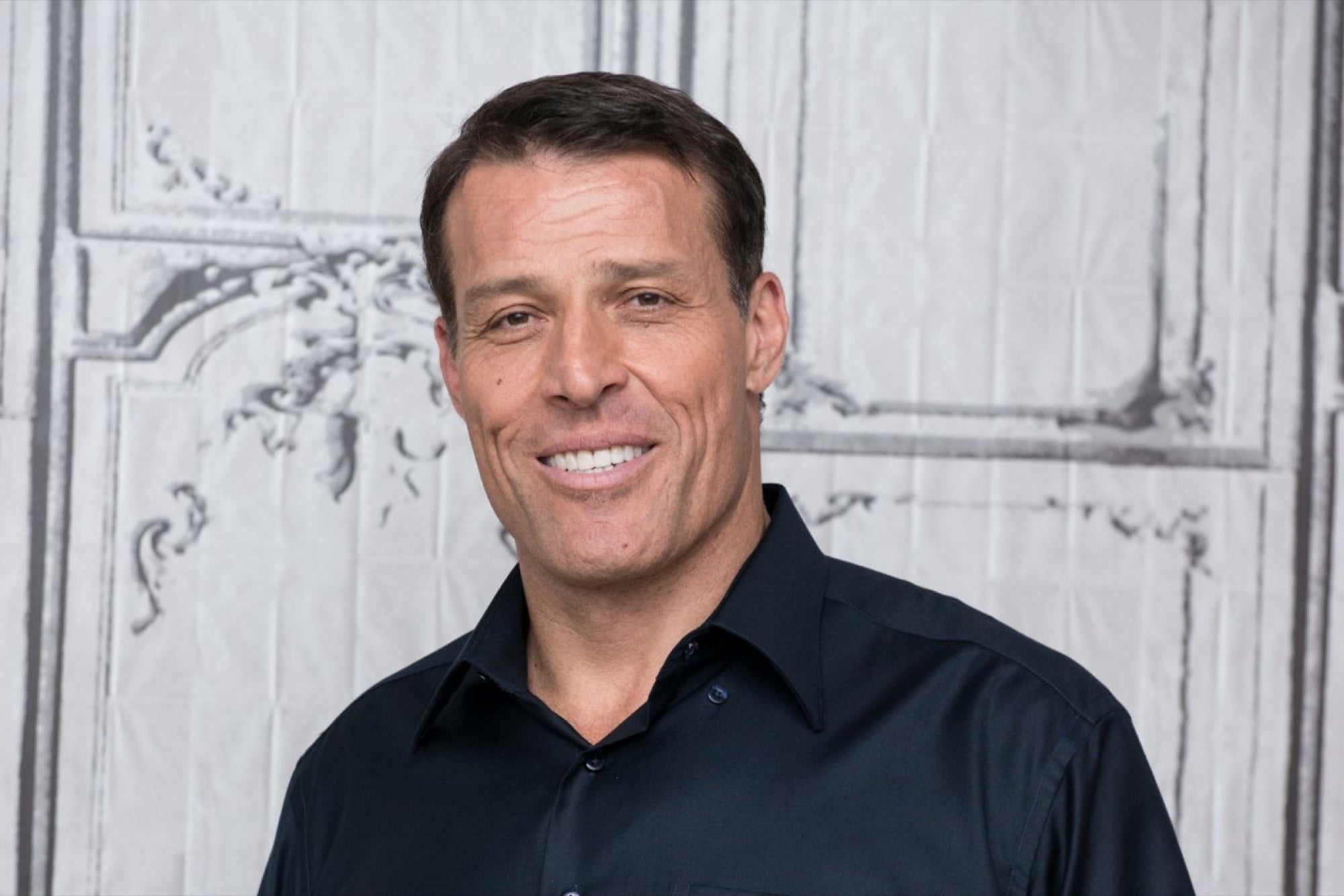 How did Tony Robbins become a millionaire?